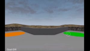 Video game screen capture. Walls of a grey maze with two coloured dots on either side - one green and one orange