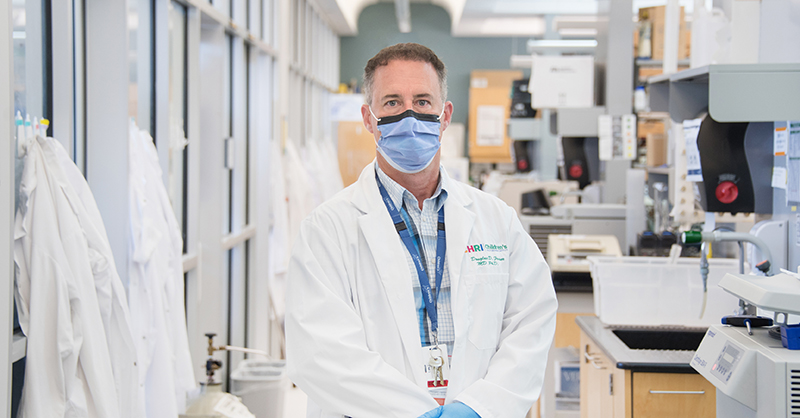 Fraser_doug_twittercard Dr. Doug Fraser wearing a mask in his lab