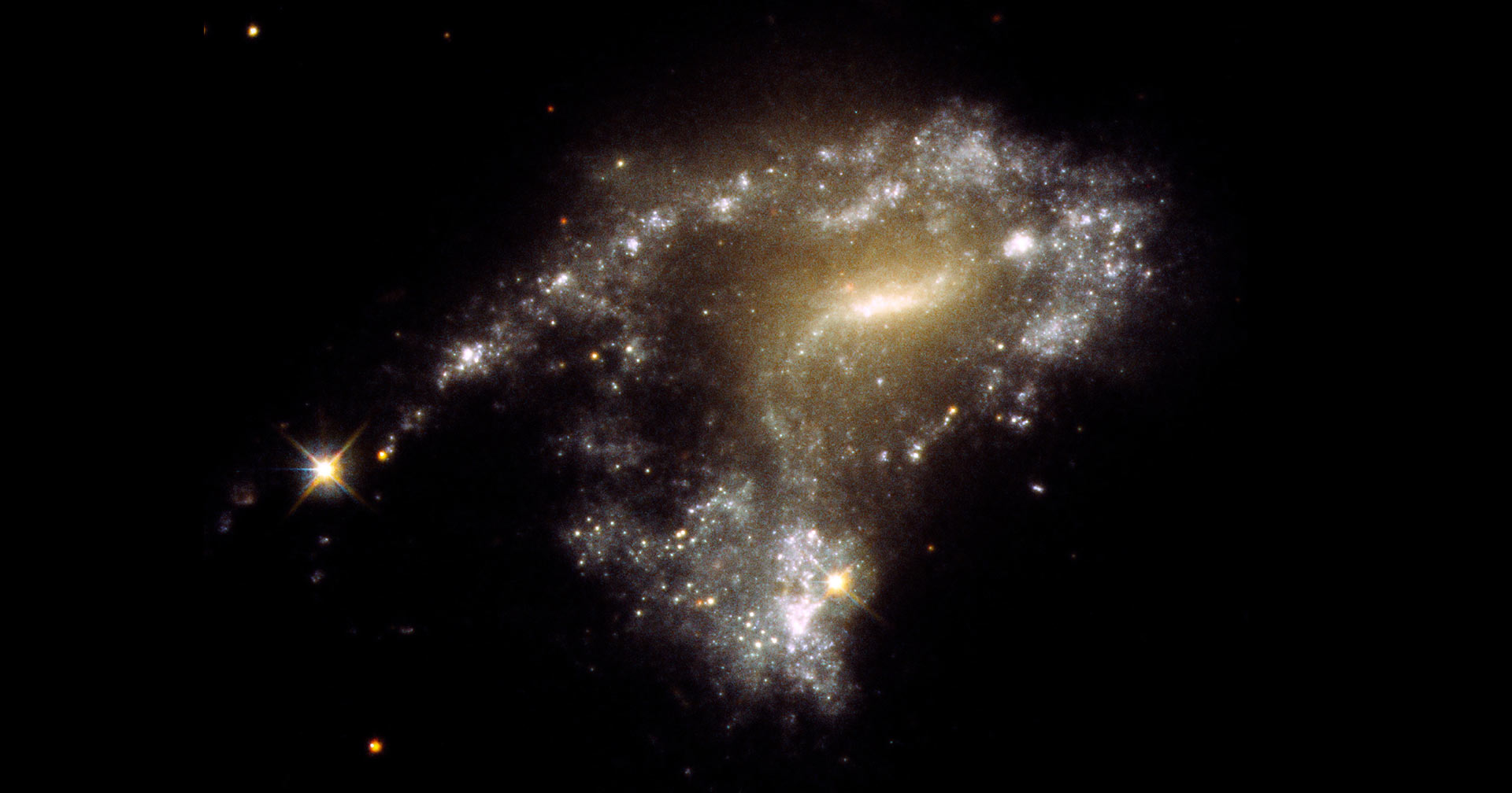 Hubble traces “string of pearls” star clusters in galaxy collisions